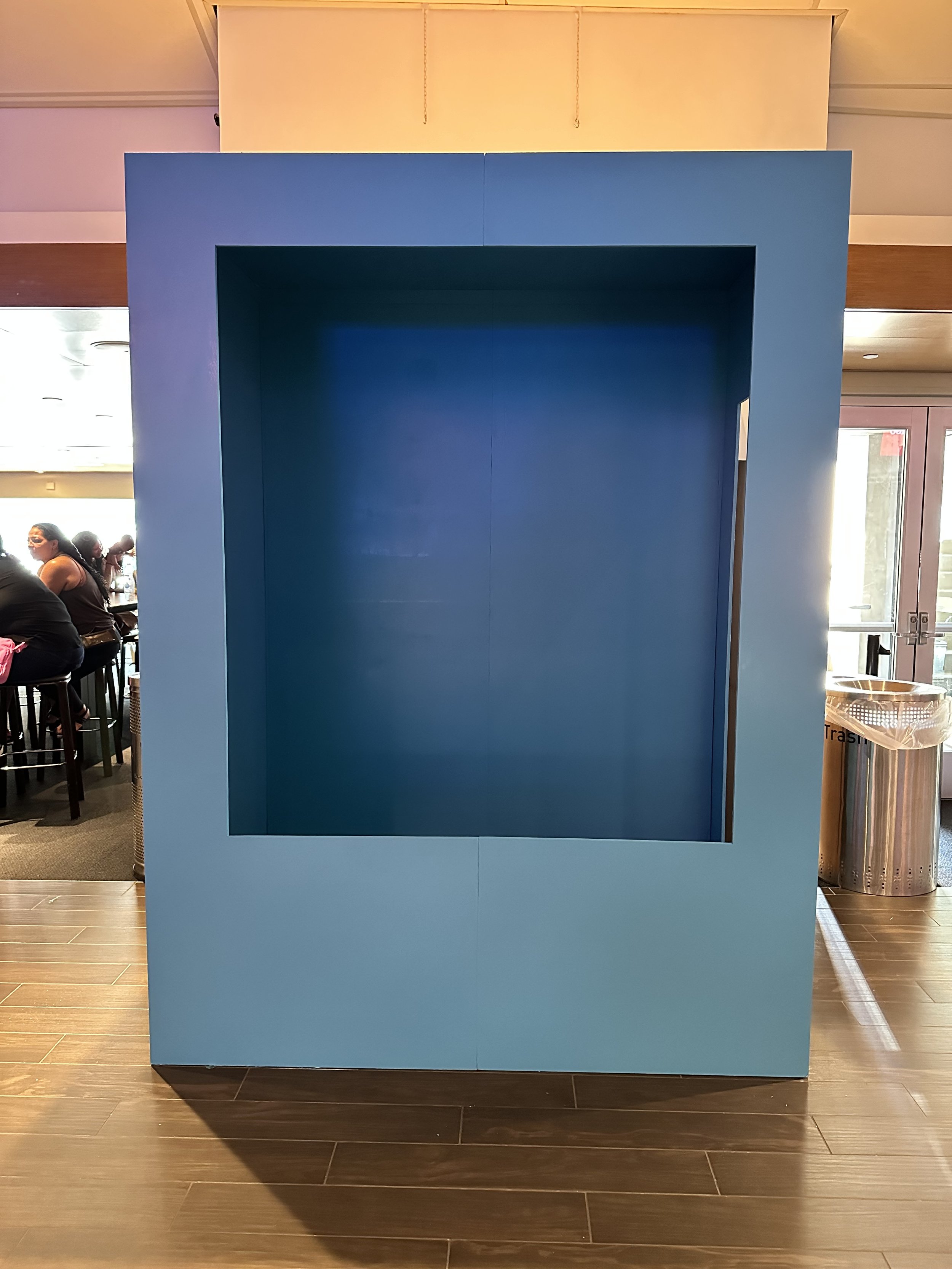 Photo Booth — blue photo box set up at an event venue